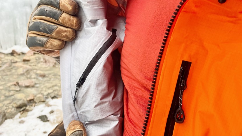 the internal zippered chest pocket is large enough to hold a phone...