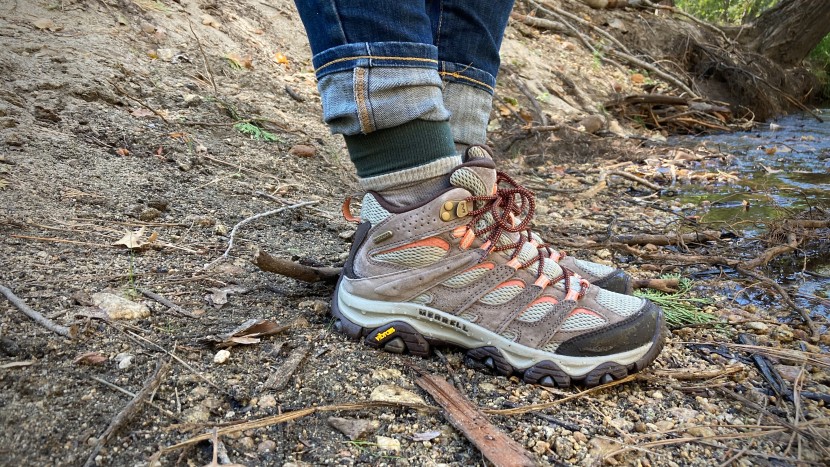 Professional hiking boots review comparison showing various models on outdoor terrain