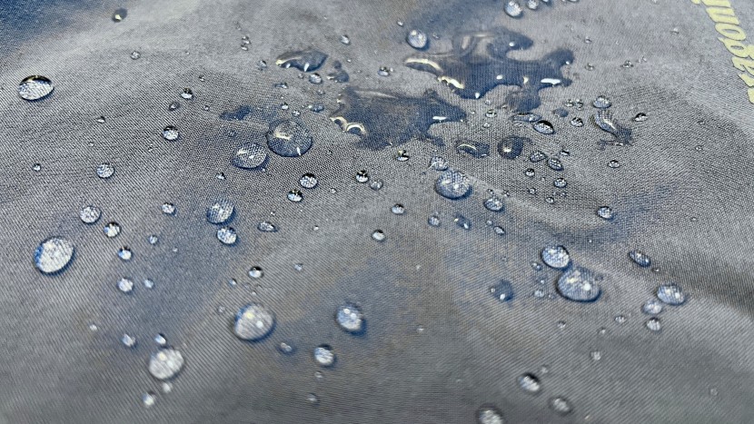 patagonia nine trails short for women - a close-up look at how the dwr-coated fabric beads most of the water.