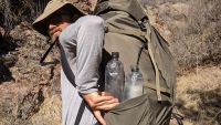 Testing water bottle pocket accessibility on the trail in Colorado.
