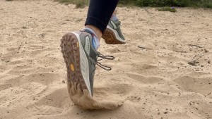 The thick heel collar of the Antora helps prevent sand from...