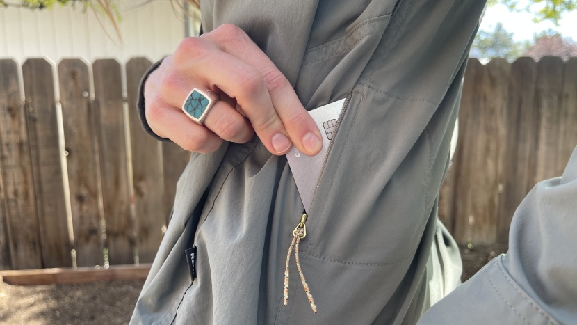 a small zippered pocket is tucked away on the left side and is just...