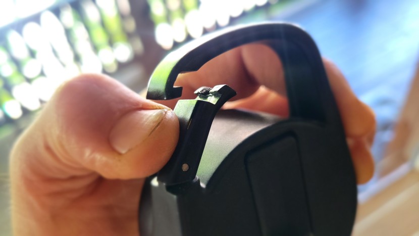 water bottle - the carabiner-style clip on the iron flask&#039;s lid aids in carrying.