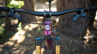 The cockpit on the Yeti is all business, 780mm carbon bars dampen...