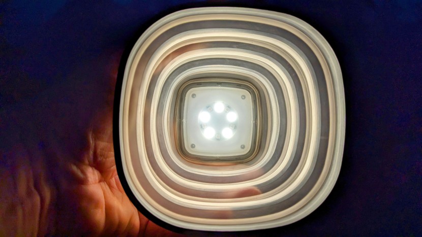the concentrated led light beams out and bounces off the rings of...