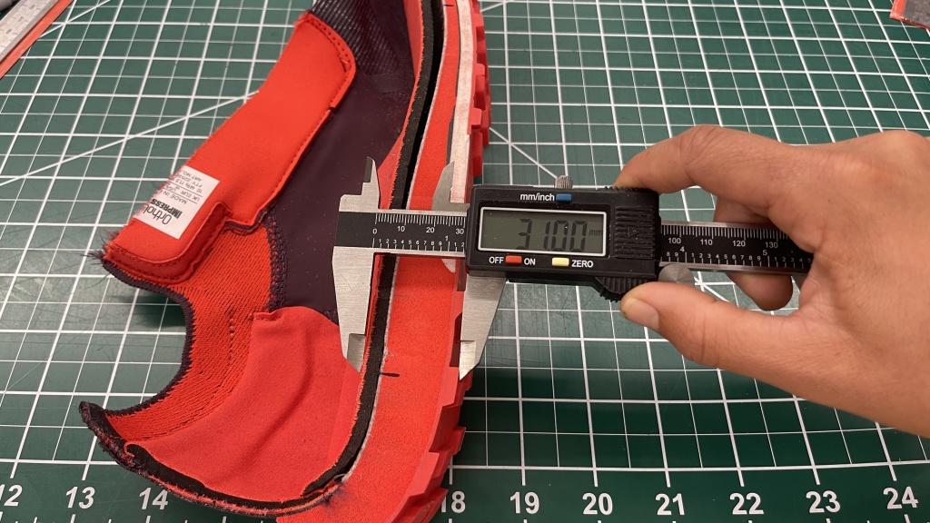 running shoes - here, you can see a crosssection of the dense foam used in the...