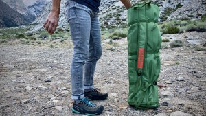 A wide shoulder strap helps to ease the burden of this heavy load.