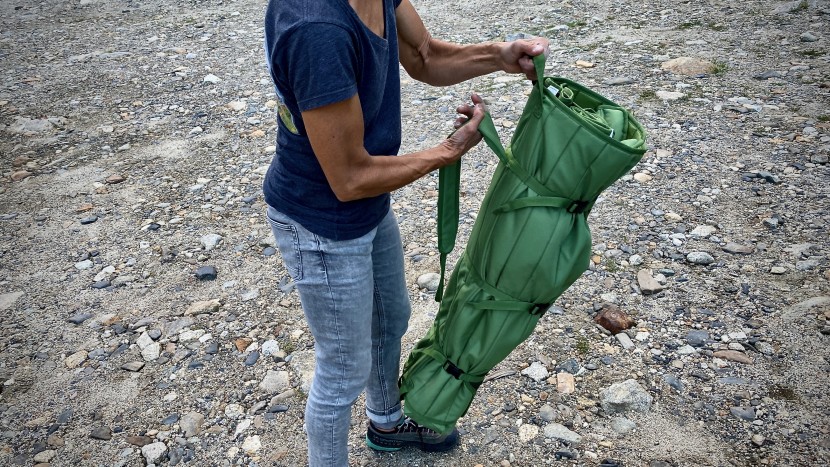 the extra loop on top of the burly carry bag helps you shoulder the...