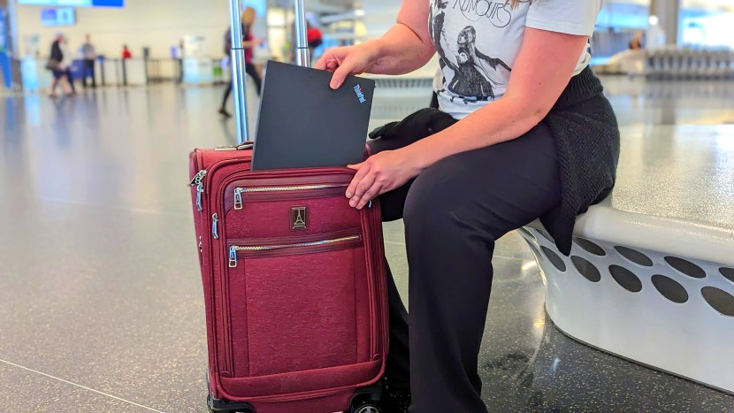 travelpro platinum elite 21&quot; expandable spinner - re-stowing our laptop after passing through tsa. the travelpro is...