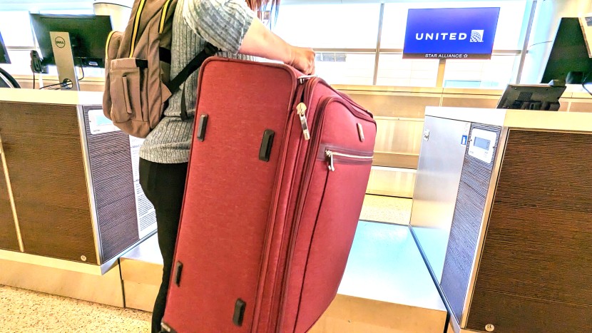 hoping to get a passing grade as we weigh our bag at check-in. extra...