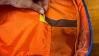The Cotopaxi 13L Chasqui has velcro straps to secure items stored in...