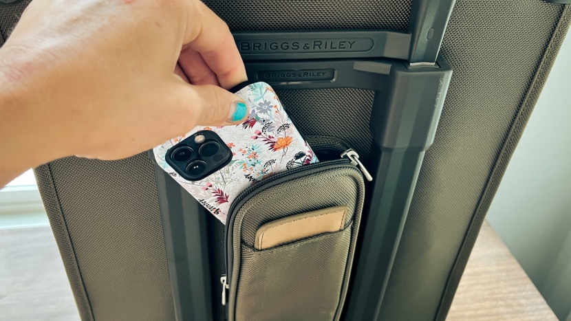the power pocket tucked discretely into the back of this bag is a...