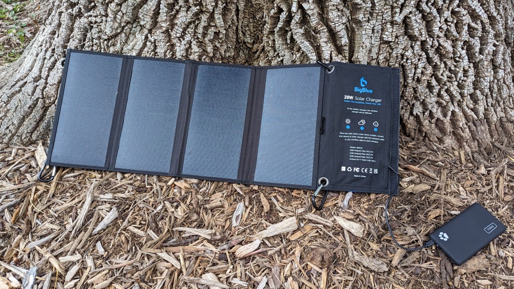 portable solar charger - testing under a large tree, in sunny colorado. this is a durable yet...