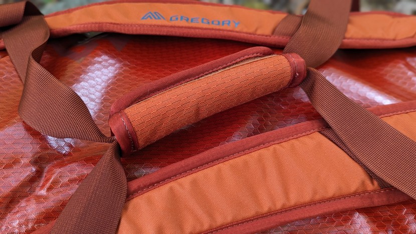 duffel bag - traditional or suitcase-style handles are a preferred method for...