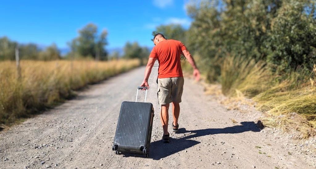 luggage - testing our rimowa&#039;s wheels on a rural dirt road.