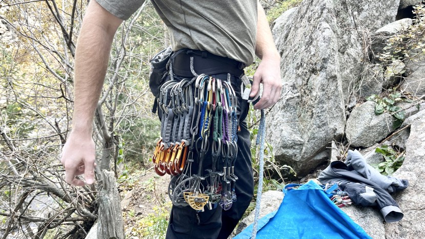 climbing harness - racking up in the petzl aquila for a long mixed-protection climb.