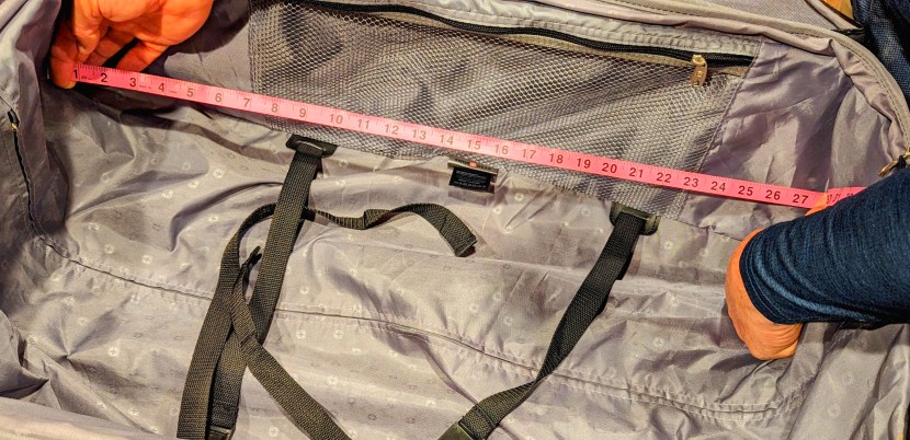 swissgear sion softside expandable roller 29" - using our trusty pink sewing tape to get the interior measurements.