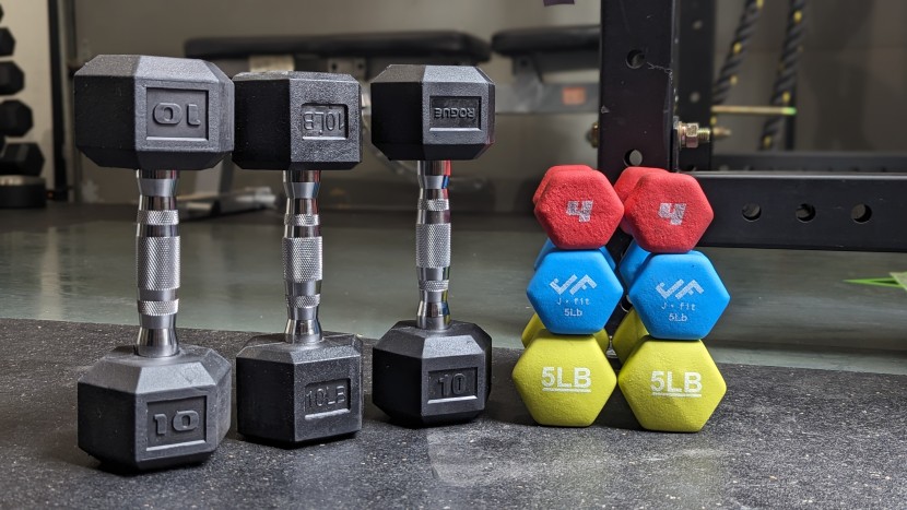 dumbbells - clear markings help identify the weight of a dumbbell; some are...