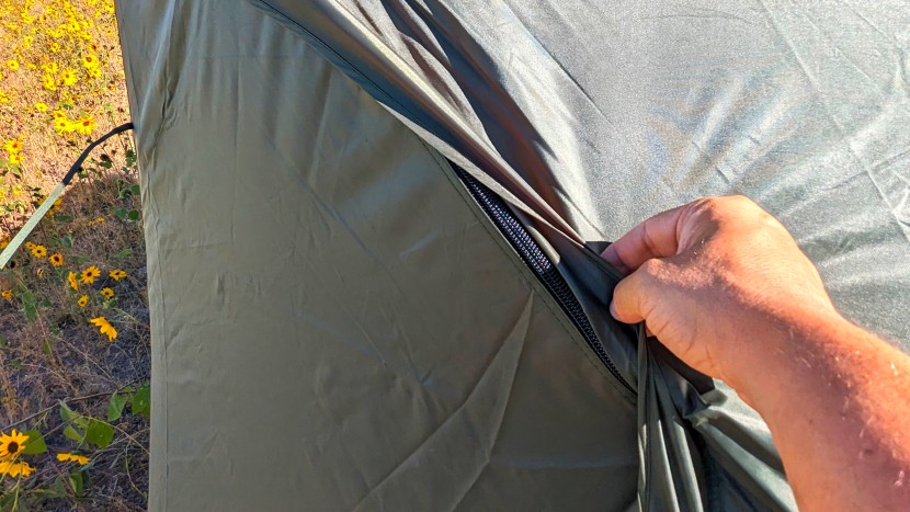 extended zipper flaps face down to keep rain from sneaking through...