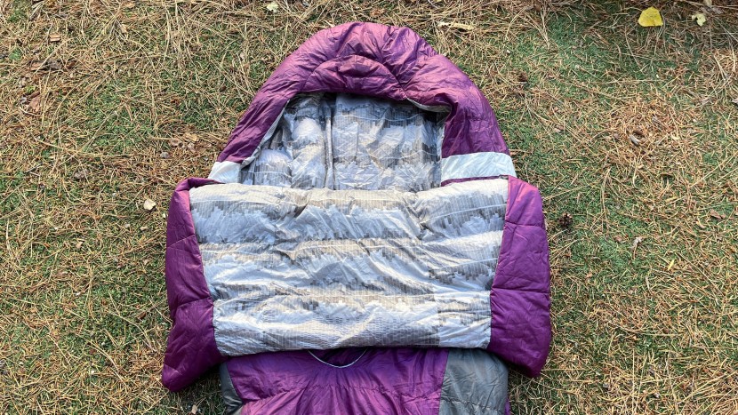 the backcountry bed's quilt untucked enables the user to sit up in...