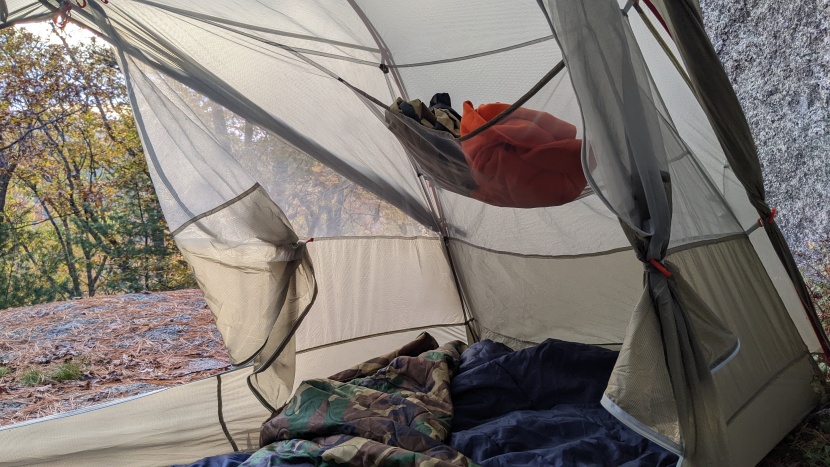 a large storage pocket over the foot of the tent holds a surprising...
