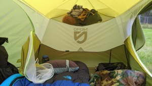Pockets above the head and foot of the tent are a good place to...