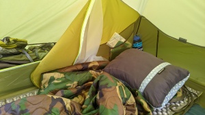 A smaller, bedside pocket will hold a book and your headlamp.