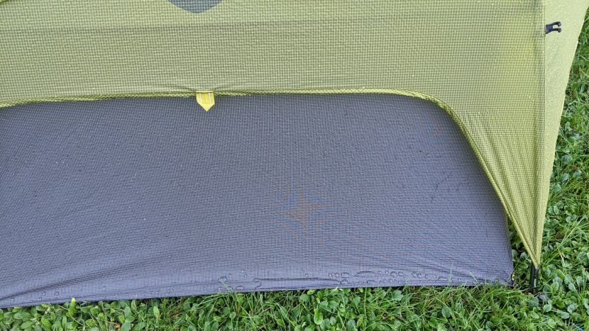 the floor fabric extends up the wall to accommodate a weight-saving...