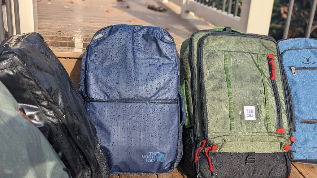 the north face base camp voyager travel backpack review - the main fabric of the voyager (blue, middle) is waterproof, but the...