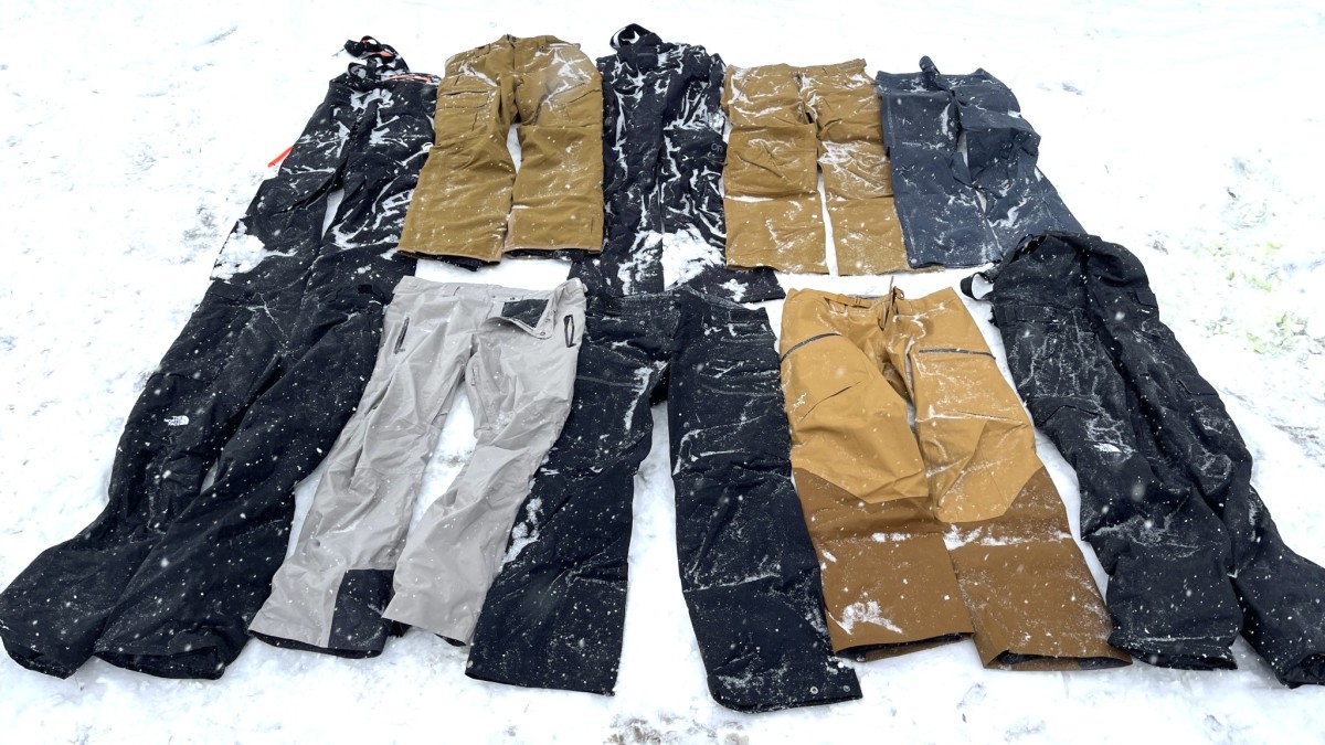 person grey jacket, black pants and blue snow boots free image
