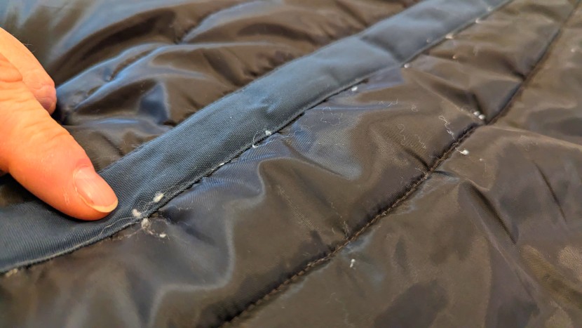 fjallraven nuuk parka - pointing out small balls of synthetic insulation that seemed to push...