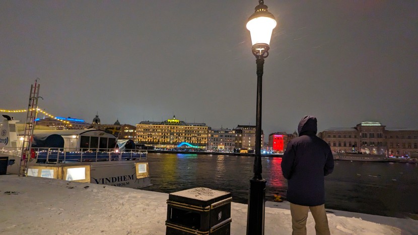 patagonia tres 3-in-1 parka - enjoying the nighttime view of the bay in stockholm, sweden.