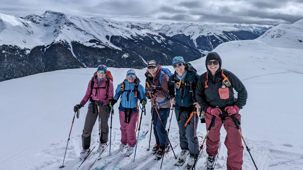 avalanche airbag - comparing and contrasting different airbags while skiing on red...