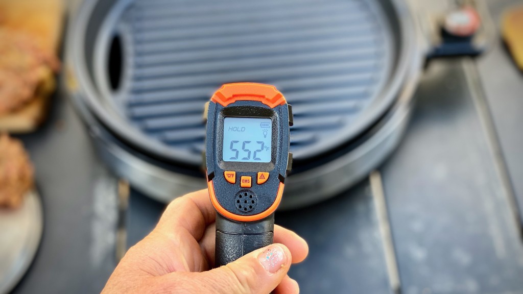 portable grill - measuring temperature using an infrared thermometer helps gauge the...