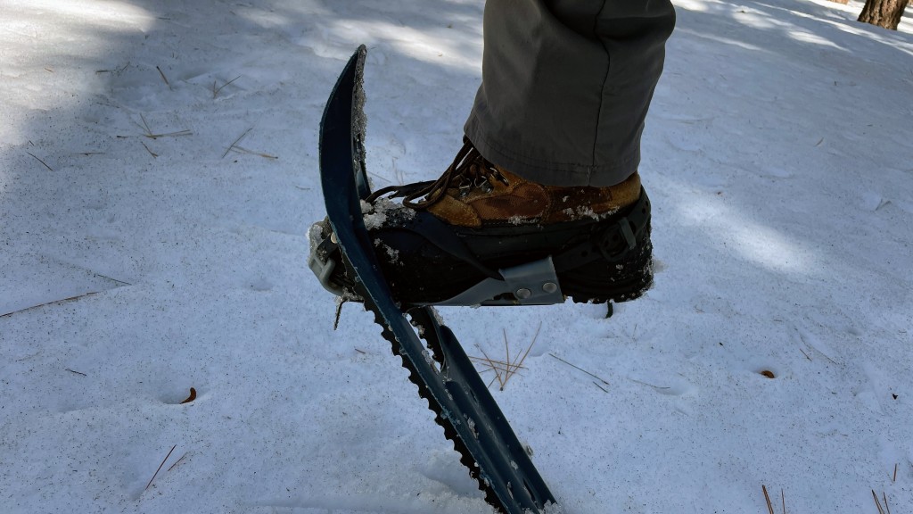 snowshoes - a hinged binding allows the snowshoe to freely rotate around your...