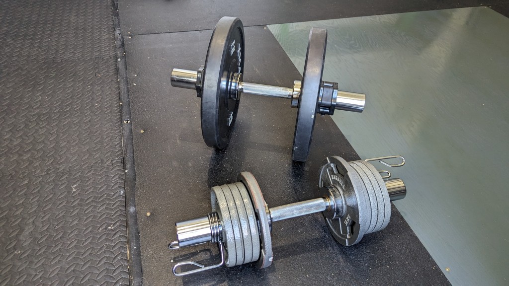 dumbbells - the titan handles fit any olympic weight plate. we tested them with...