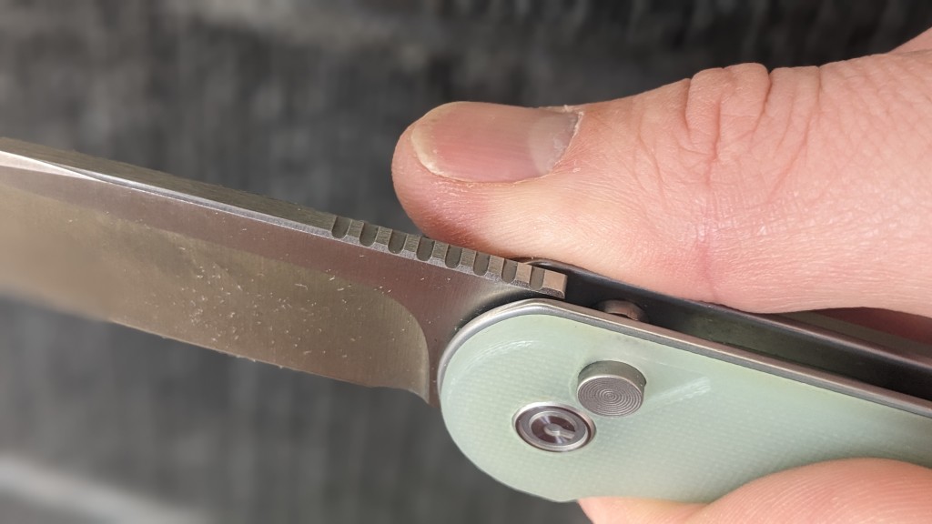 civivi button lock elementum ii - the jimping along the spine of the blade offers an aggressive, but...