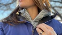 A shell over a down jacket can help keep in body heat while...
