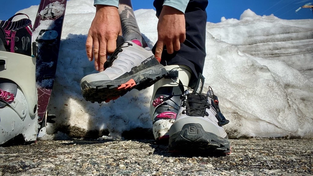 hiking shoes womens - changing from ski boots into the comfort of the salomon x ultra 4.