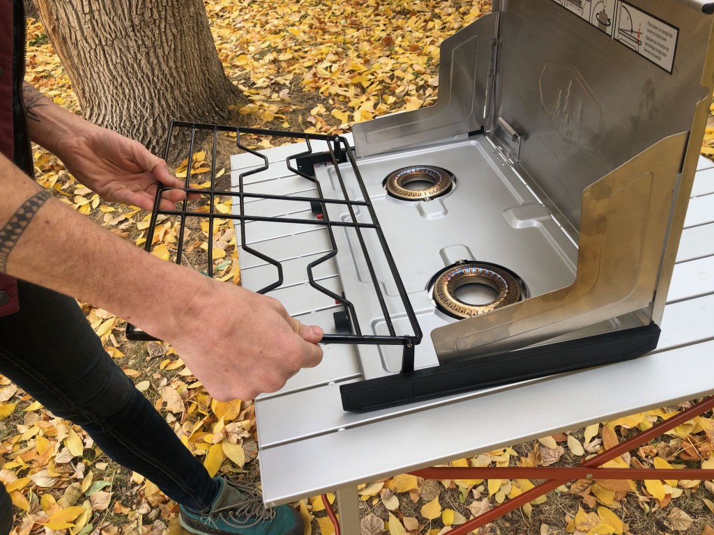 camping stove - cleaning the pinnacle pro's drip pan requires unhooking the grate...