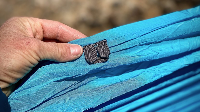eight gear slings line the sides of the kammok roo double hammock...