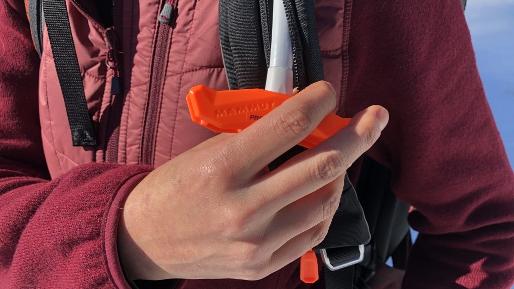 avalanche airbag - the traditional, big orange handle sticking out from your shoulder...