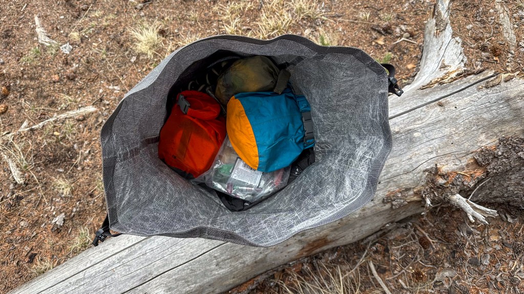 black diamond beta light 45 - the large roll top opening makes it easy to grab items inside the...