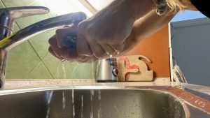 Ringing out all the water absorbed by the Amazon Essentials Casual...
