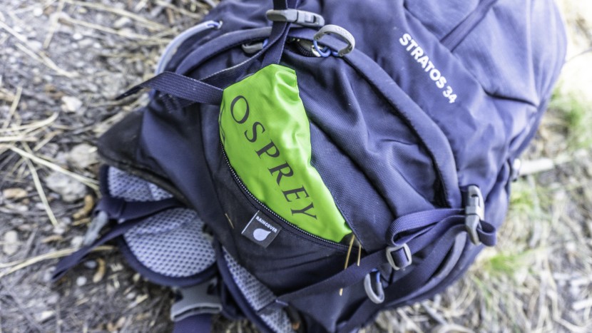 daypack - the osprey stratos 34 includes a rain cover that has it&#039;s own pocket...