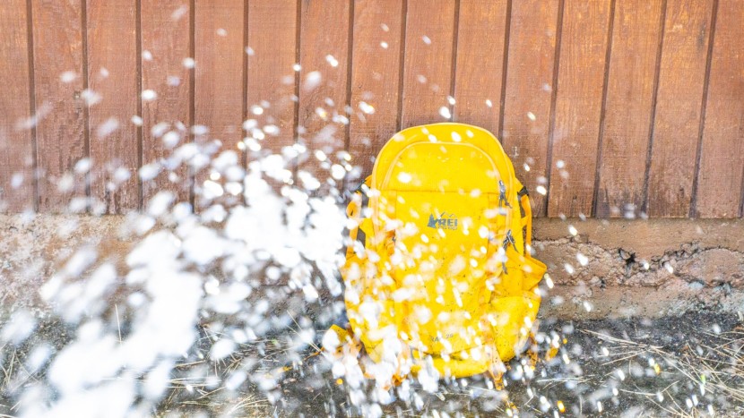 daypack - we sprayed every single pack for one minute with a garden hose at...