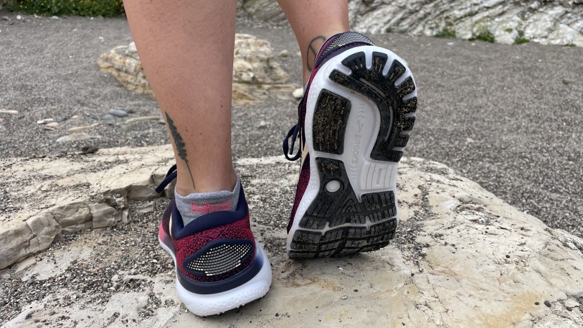 running shoes womens - rocks covered in beach sand can be incredibly slippery, making them...