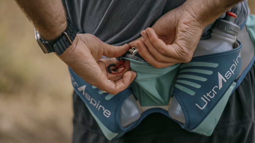 hydration pack for running men - hard bottles can make accessing pockets more difficult, especially...