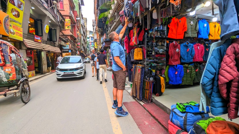 shopping day packs at a local gear shop in kathmandu, nepal. the...