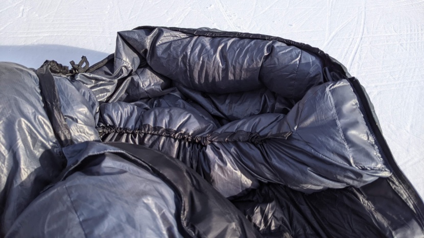 thin but sturdy strands snug down the hood and collar.